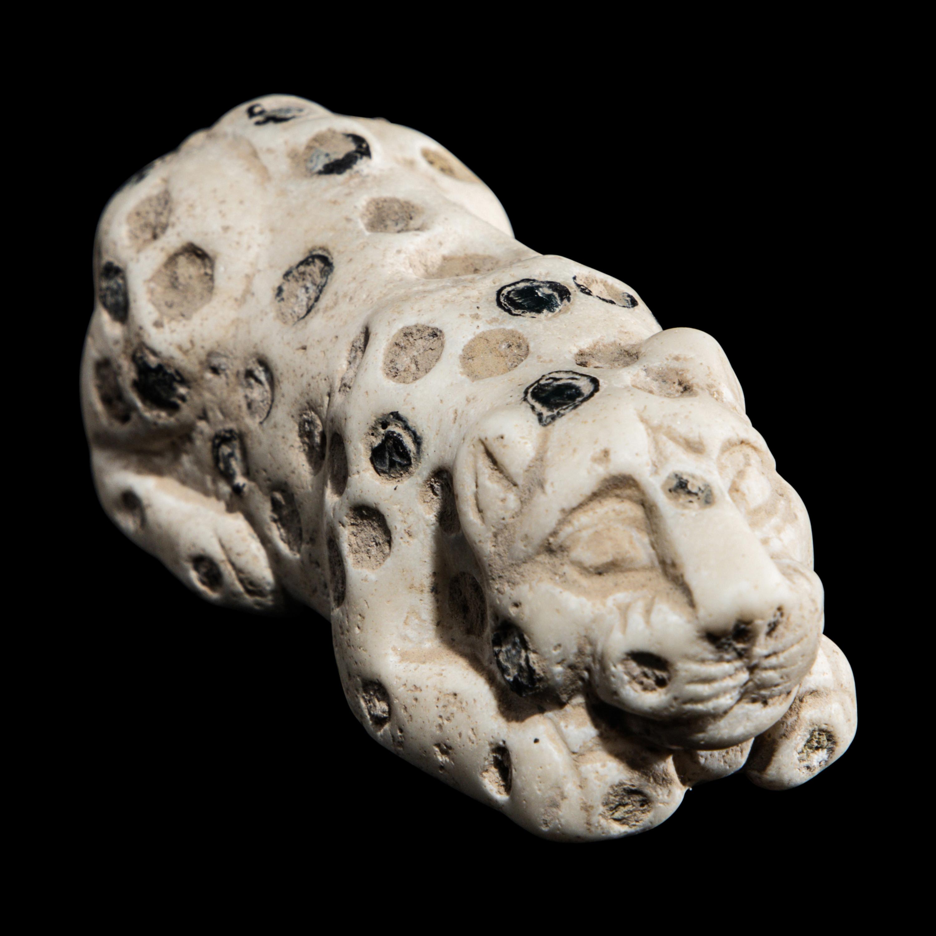 A Mesopotamian Marble and Lapis Lazuli Inlay Recumbent Feline