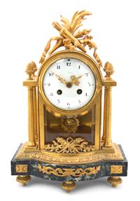 A French Gilt Bronze and Marble Mantel Clock, retailed by J.E. Caldwell & Co., Height 13 1/4 inches.