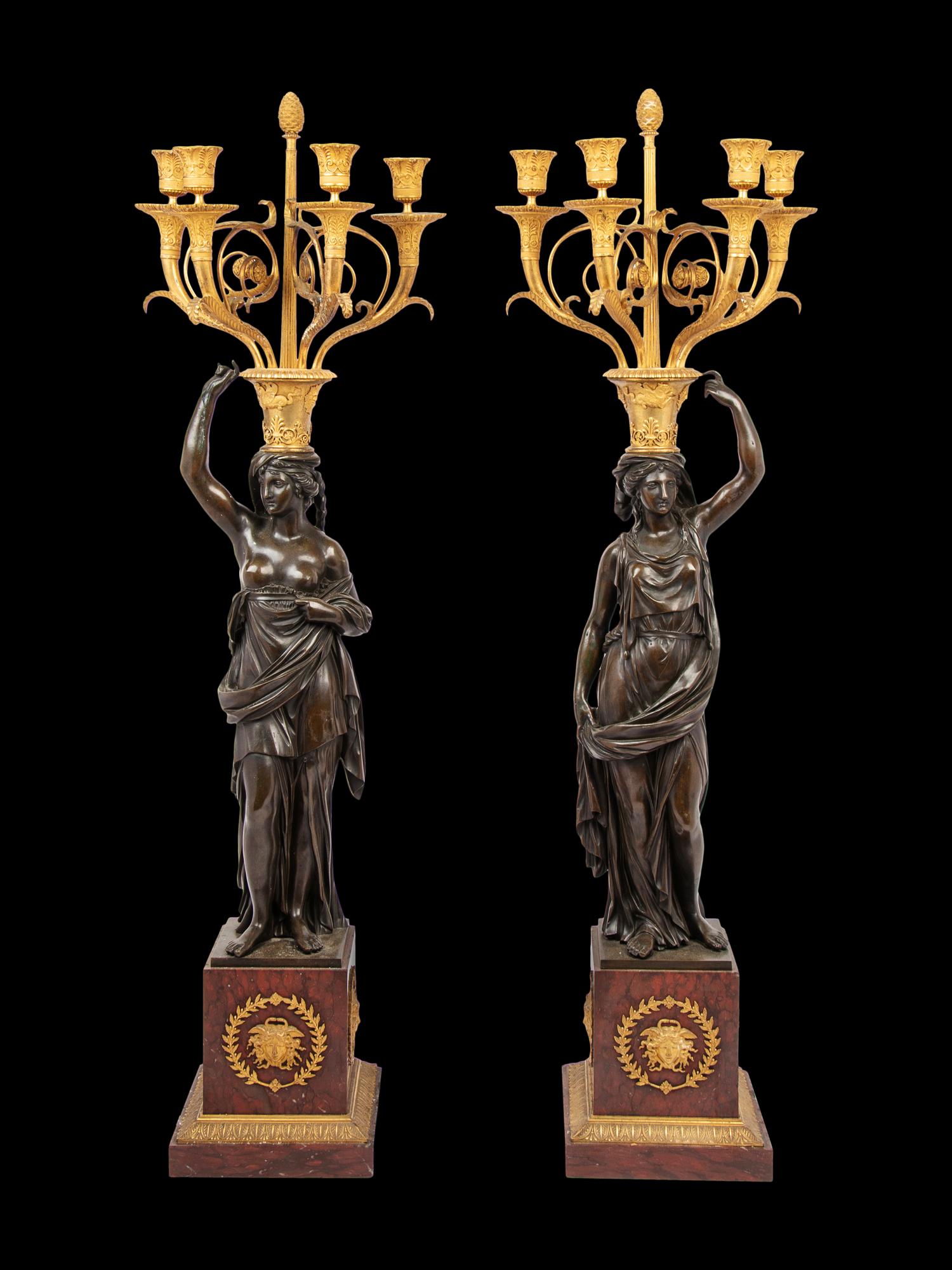 A Pair of Empire Style Gilt and Patinated Bronze and Marble Figural Four-Light Candelabra