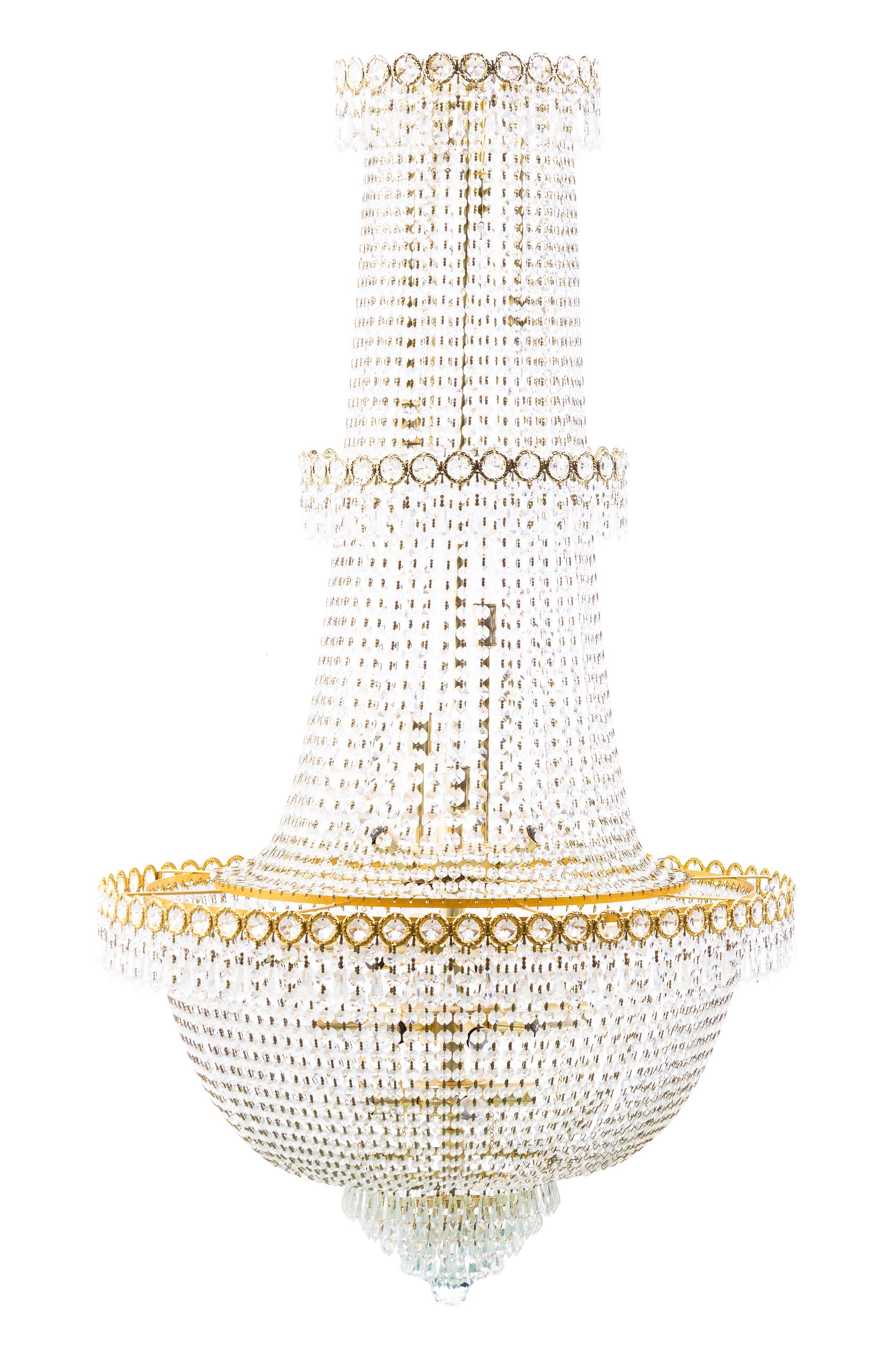 A Louis XVI Style Gilt Metal and Cut Glass Chandelier, Height 51 x diameter 27 1/2 inches.
