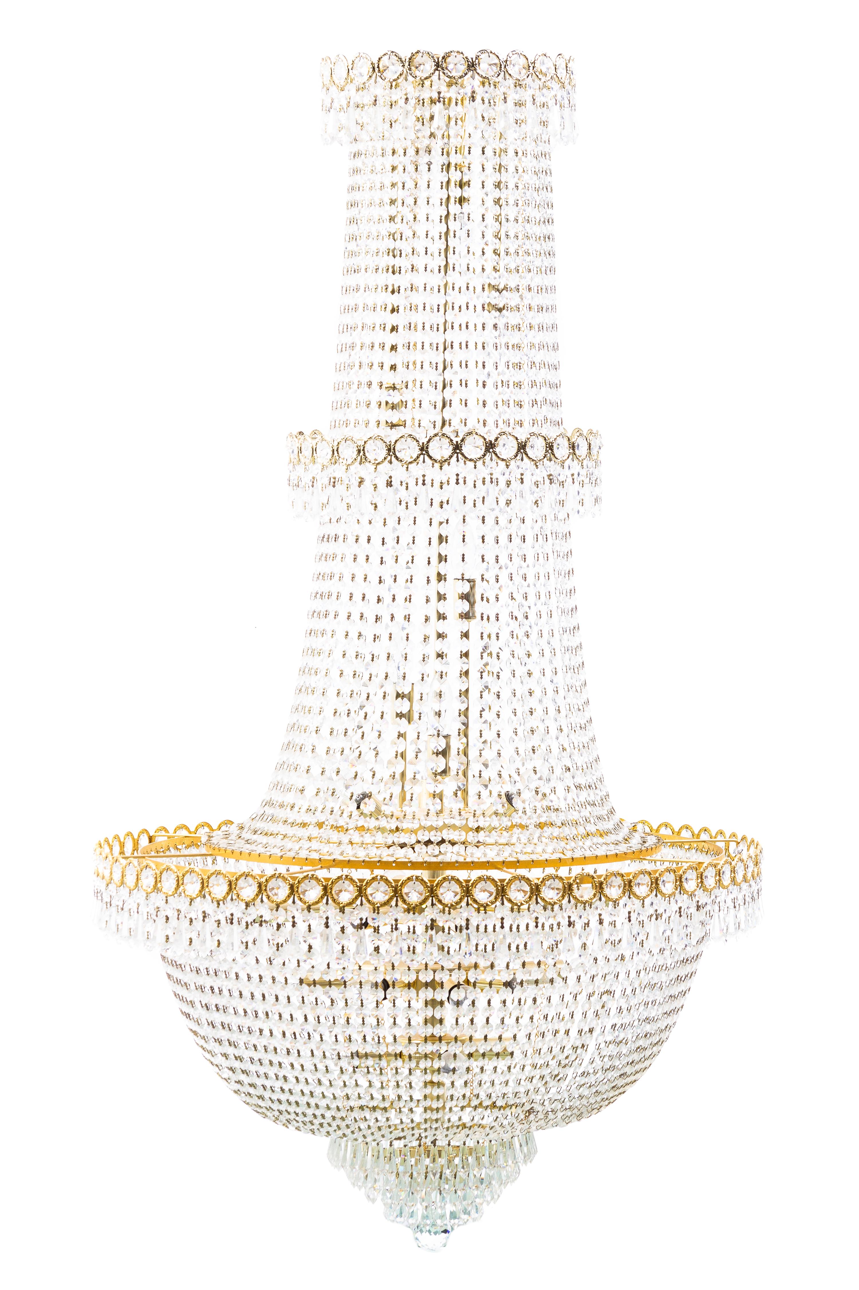 A Louis XVI Style Gilt Metal and Cut Glass Chandelier, Height 51 x diameter 27 1/2 inches.