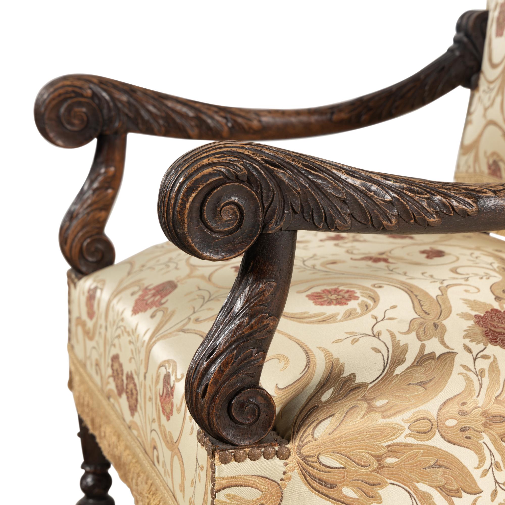 A Pair of Louis XIII Style Carved Oak Fauteuils