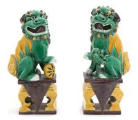 A Pair of Chinese Sancai Glazed Porcelain Foo Dogs — 20TH CENTURY