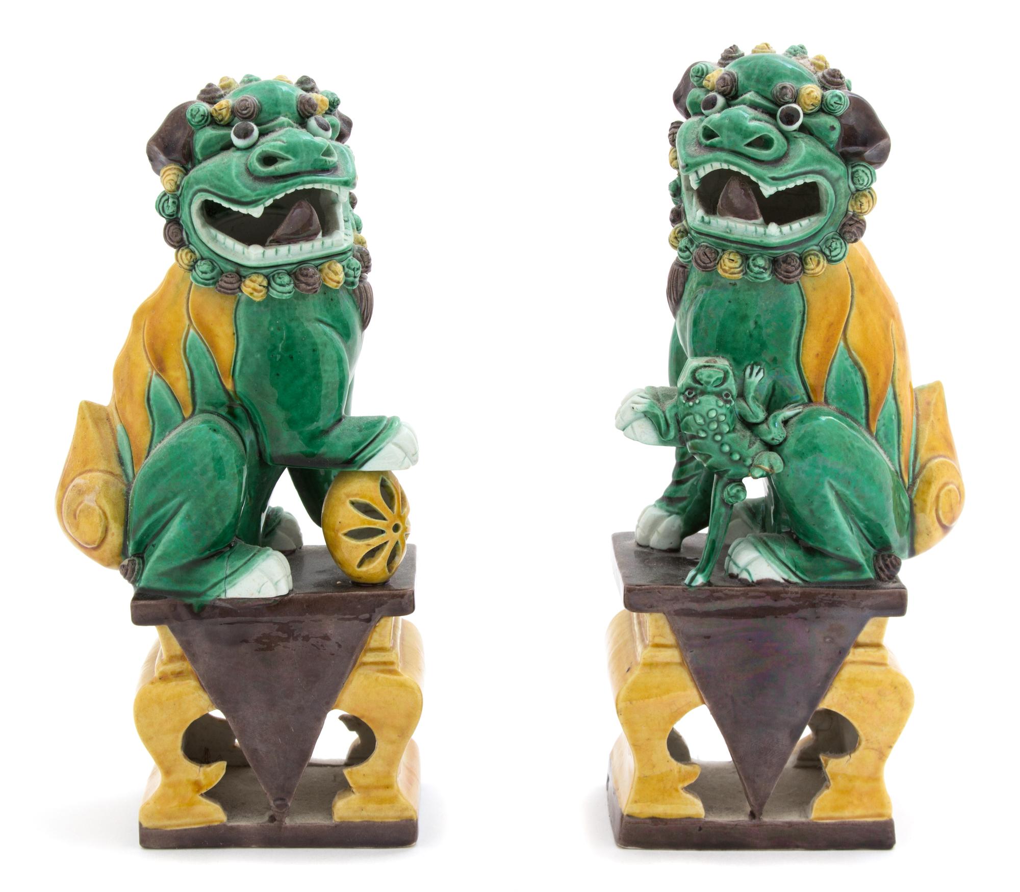 A Pair of Chinese Sancai Glazed Porcelain Foo Dogs — 20TH CENTURY