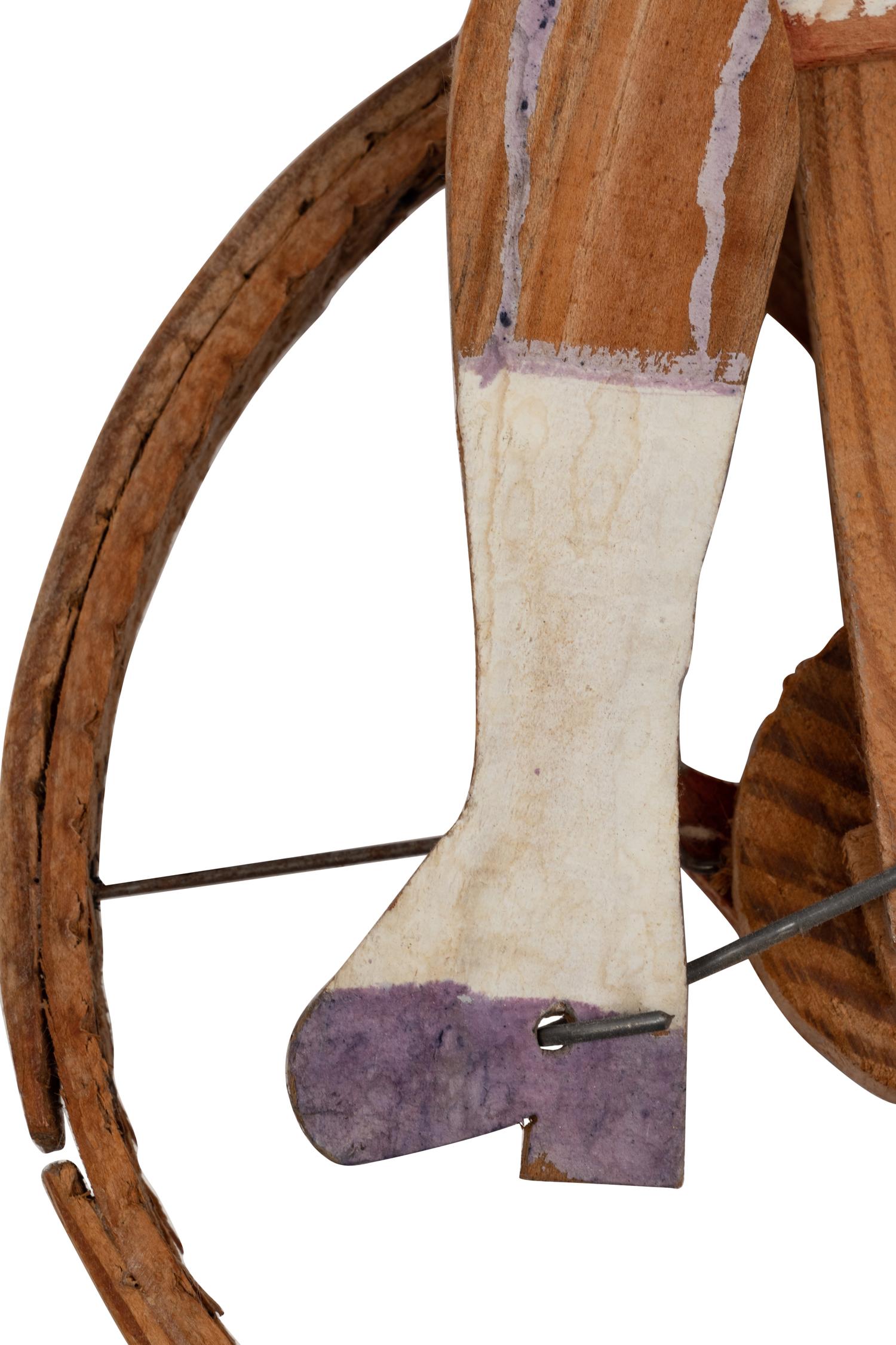 A Child’s Carved and Painted Wood Unicycle Push Toy