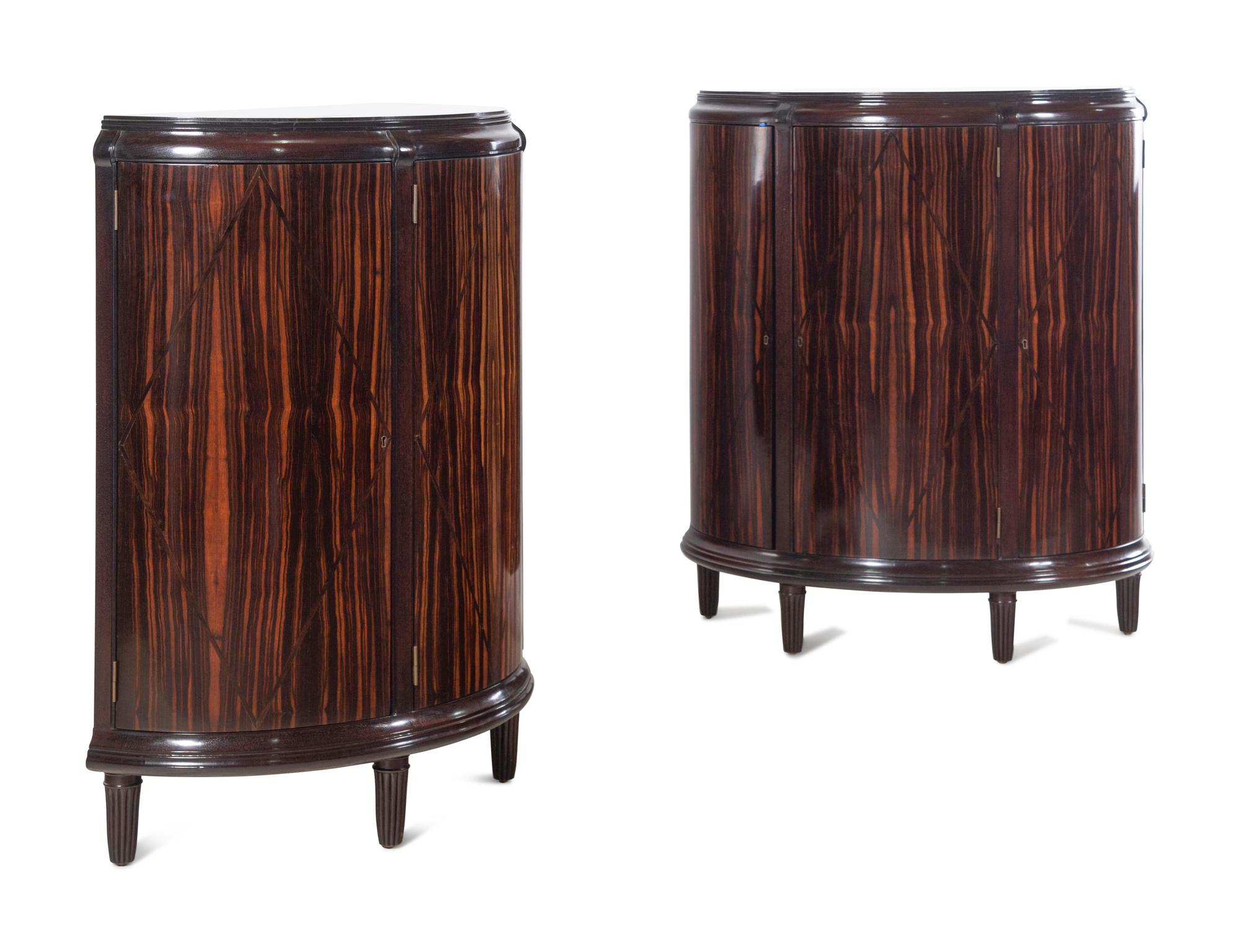 A Pair of Dessin Fournir Walnut and Banded Rosewood Demilune Cabinets