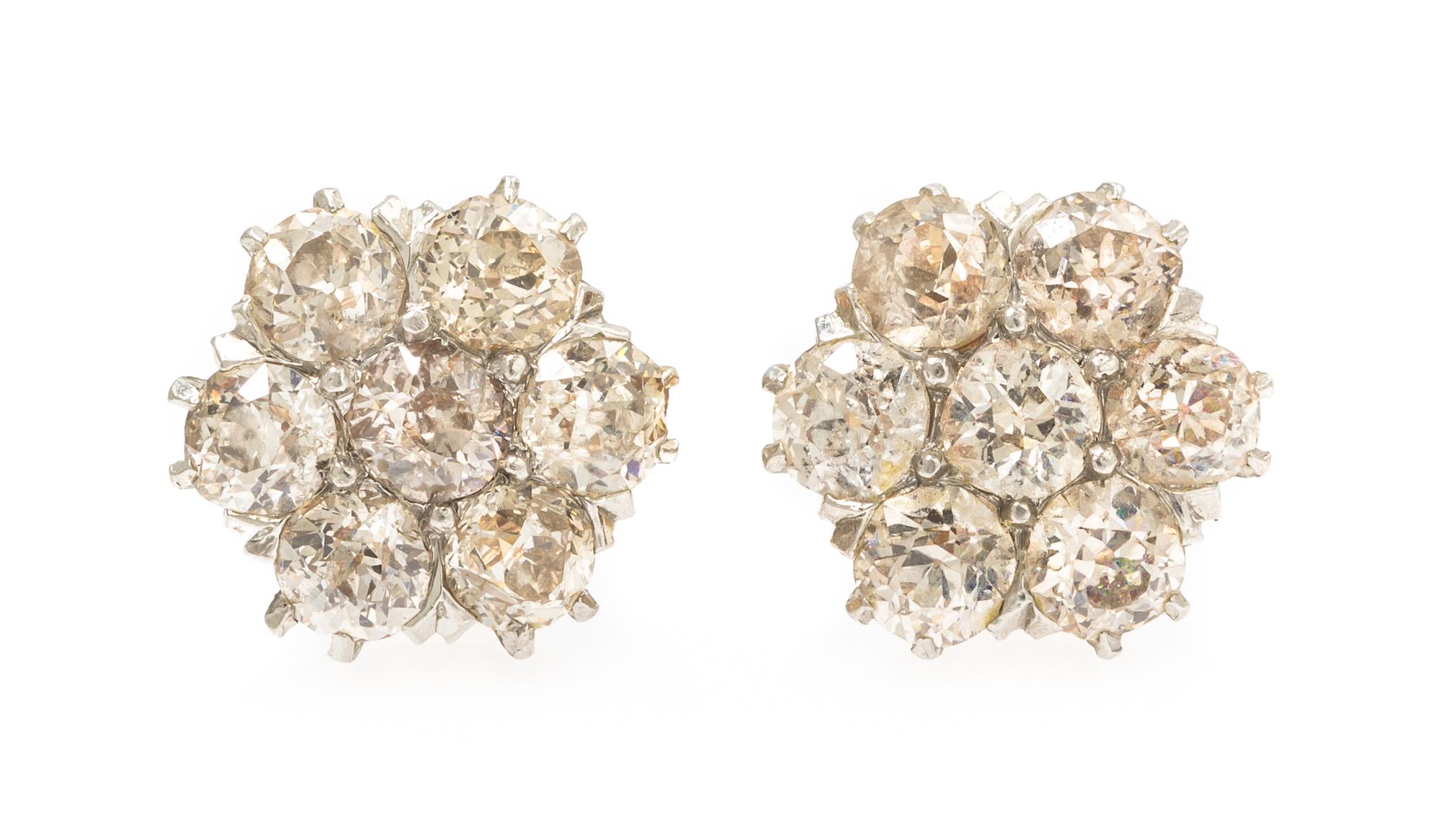 A Pair of Platinum Topped Gold and Diamond Cluster Earrings, 2.60 dwts.