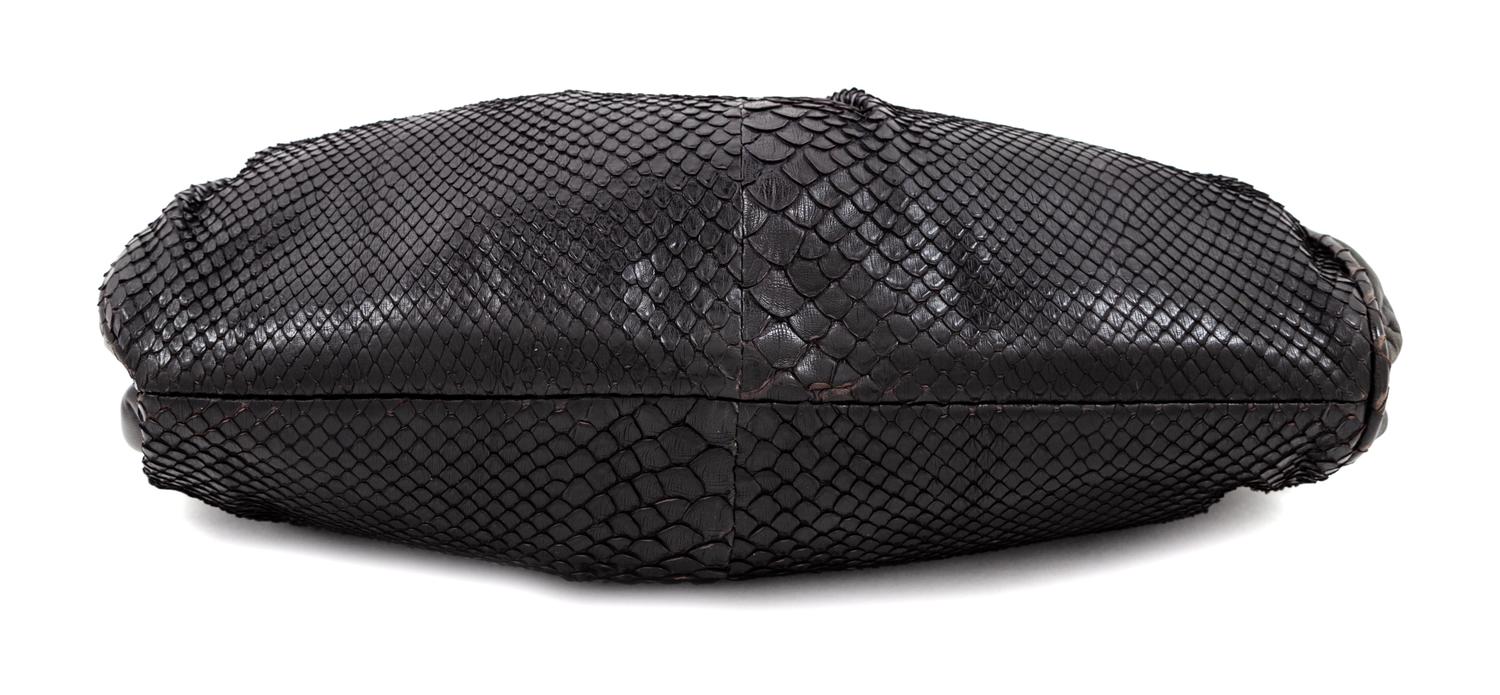 A Bottega Veneta Black Python Clutch, 8" H x 11.25" W x 1.5" D.