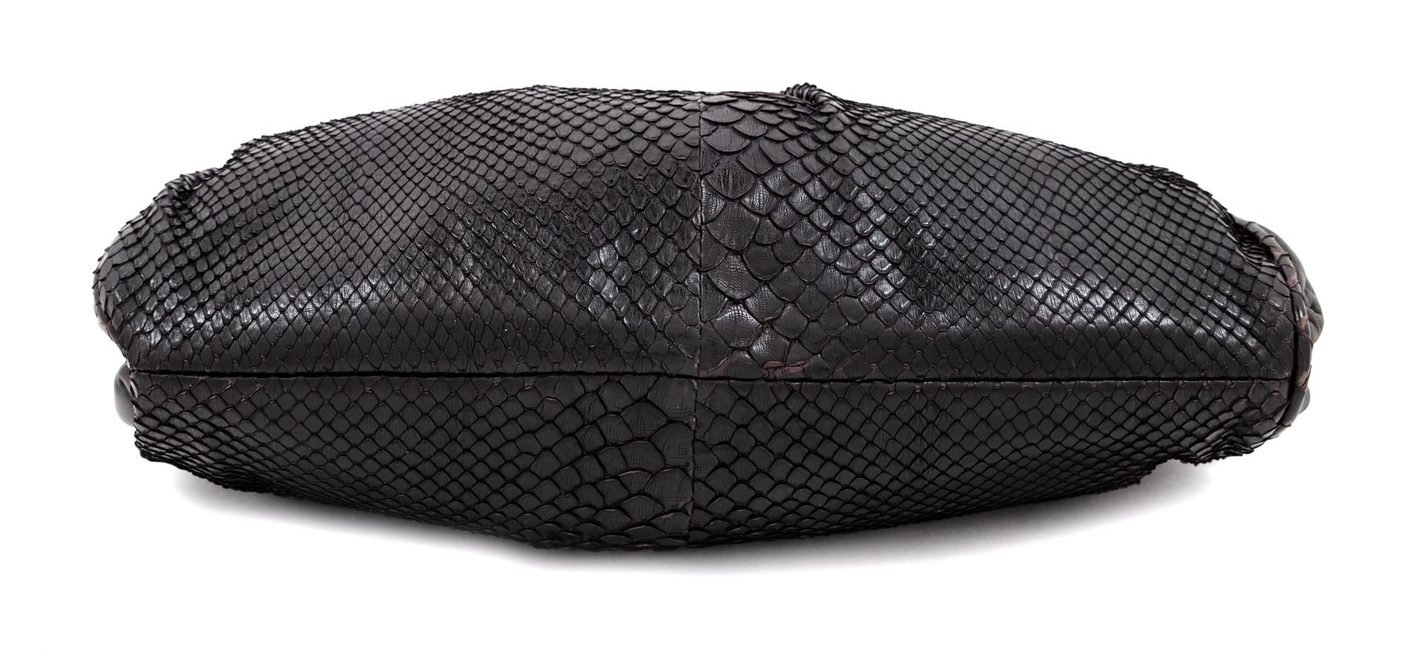 A Bottega Veneta Black Python Clutch, 8" H x 11.25" W x 1.5" D.