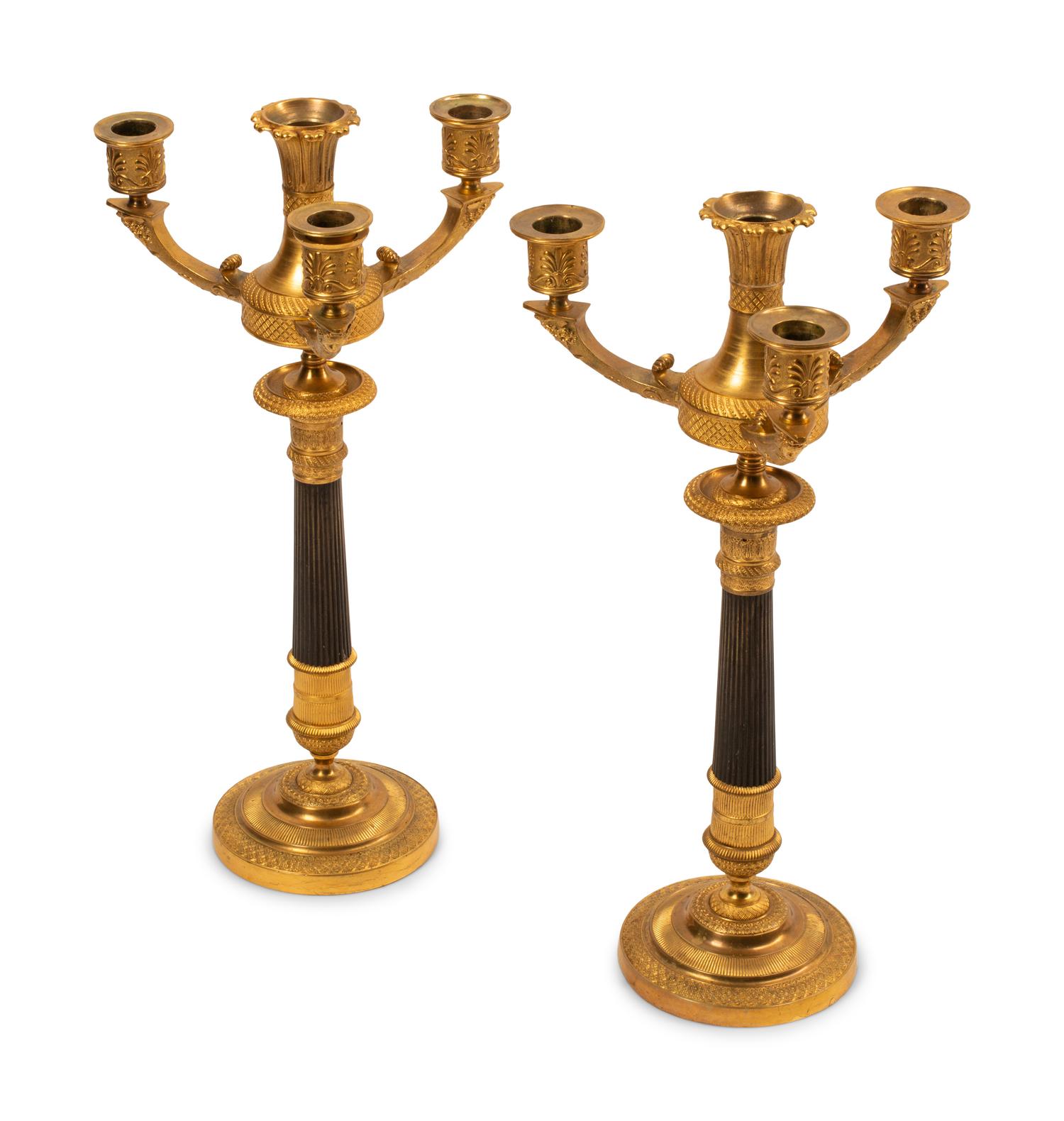 A Pair of Empire Style Gilt and Patinated Bronze Four-Light Candelabra