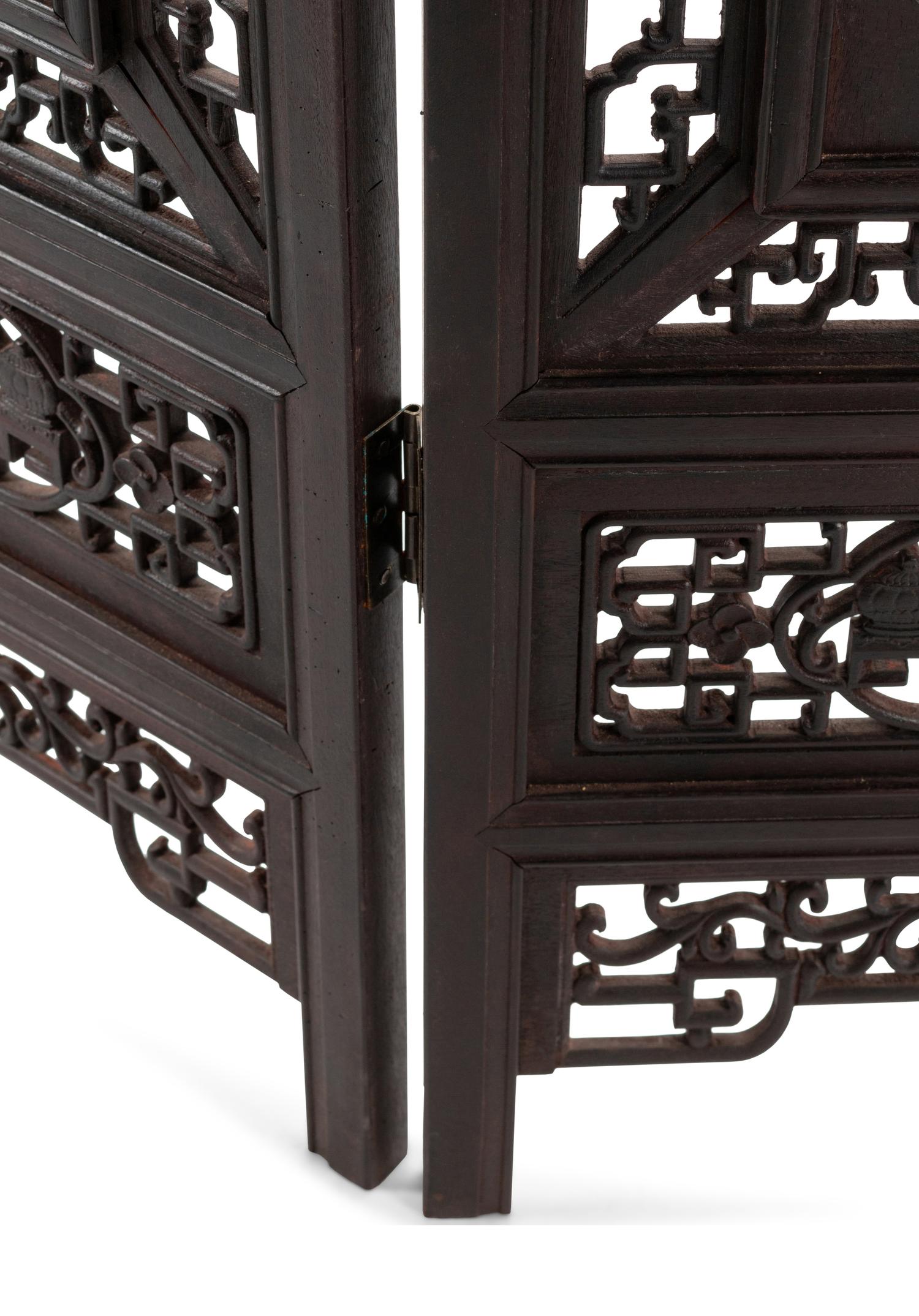 A Chinese Porcelain-Inset Pierce Carved Hardwood Floor Screen