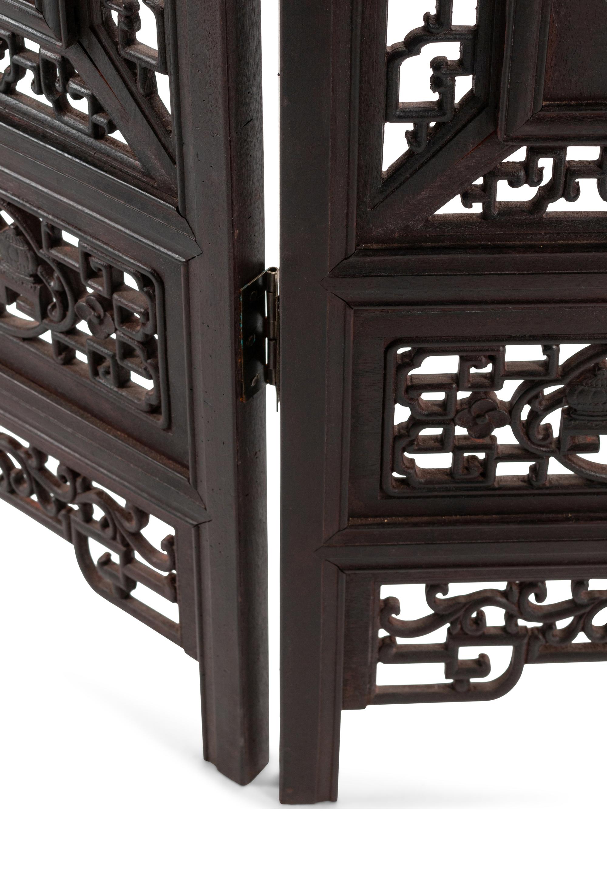A Chinese Porcelain-Inset Pierce Carved Hardwood Floor Screen