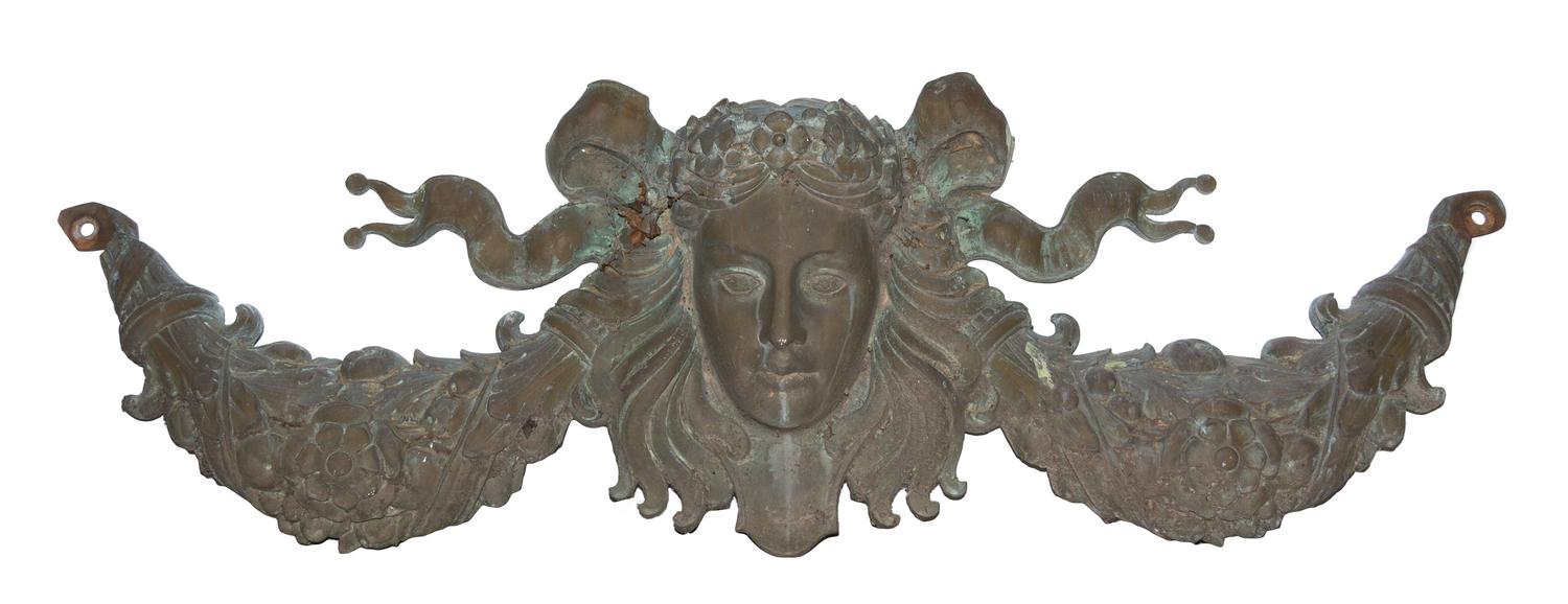 A Patinated Cast Metal Wall Applique Width 57 inches.