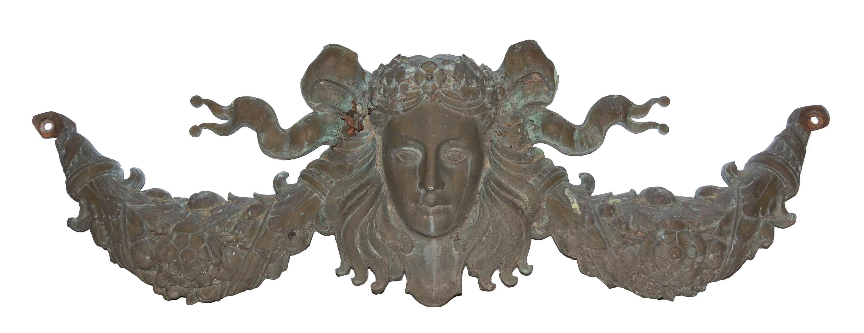 A Patinated Cast Metal Wall Applique Width 57 inches.