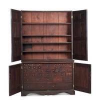A Chippendale Style Walnut Paneled Step Back Cupboard