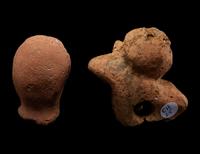 A Nubian Terracotta Head and Reclining Figure