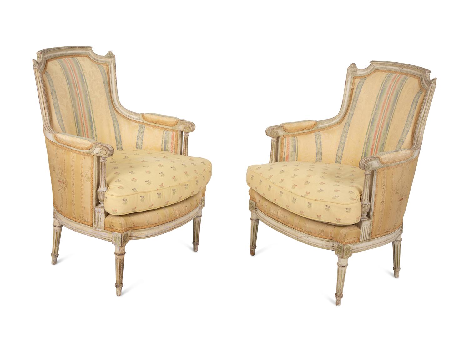 A Pair of Louis XVI Style Painted and Upholstered Bergeres — 20TH CENTURY