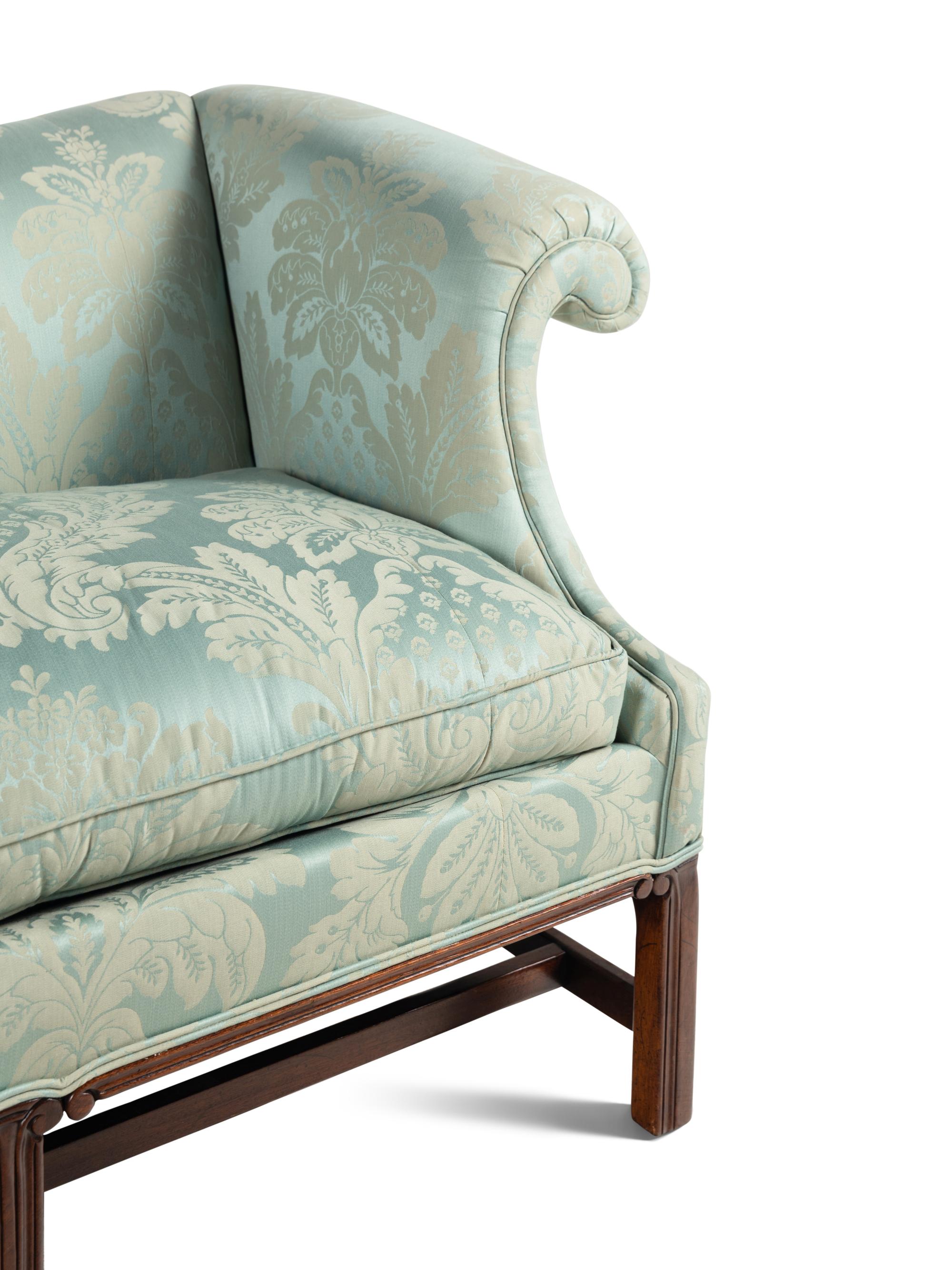 A Georgian Style Damask Upholstered Camelback Sofa