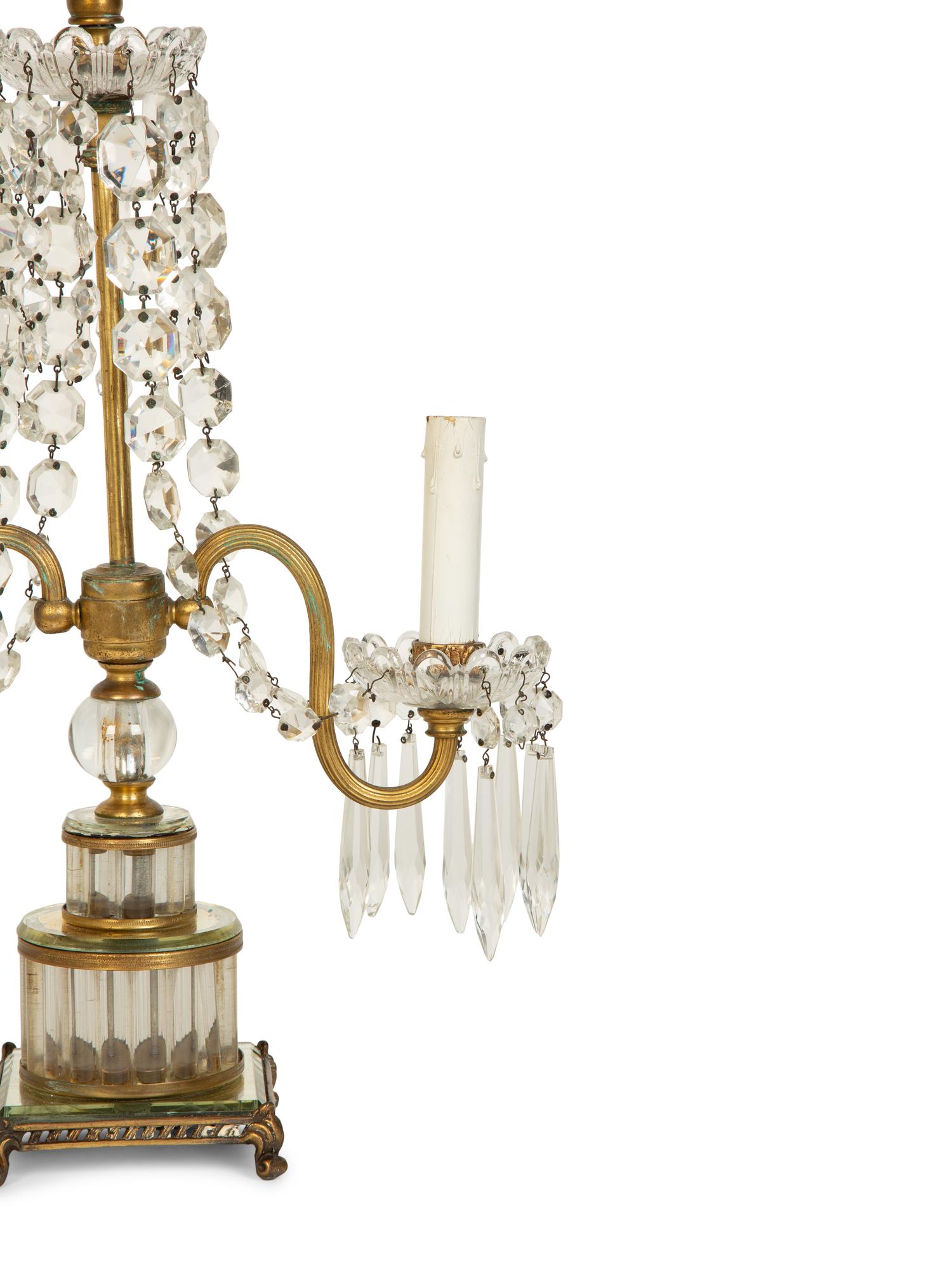 A Pair of Continental Gilt Metal and Glass Two-Light Candelabra