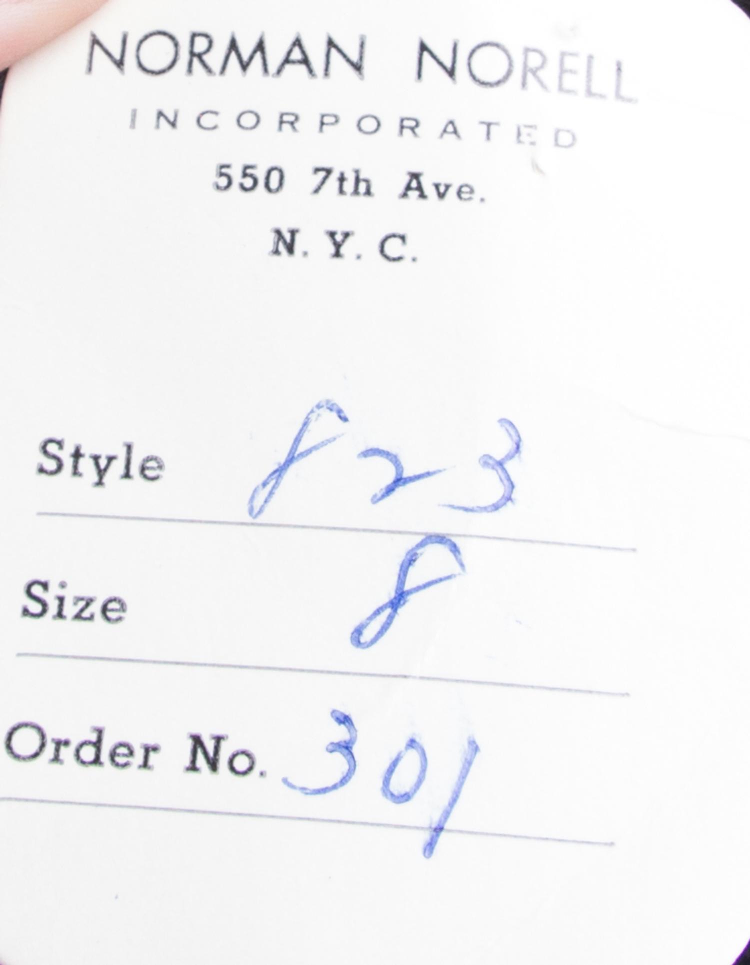 A Norell Black Wool Strapless Dress,
