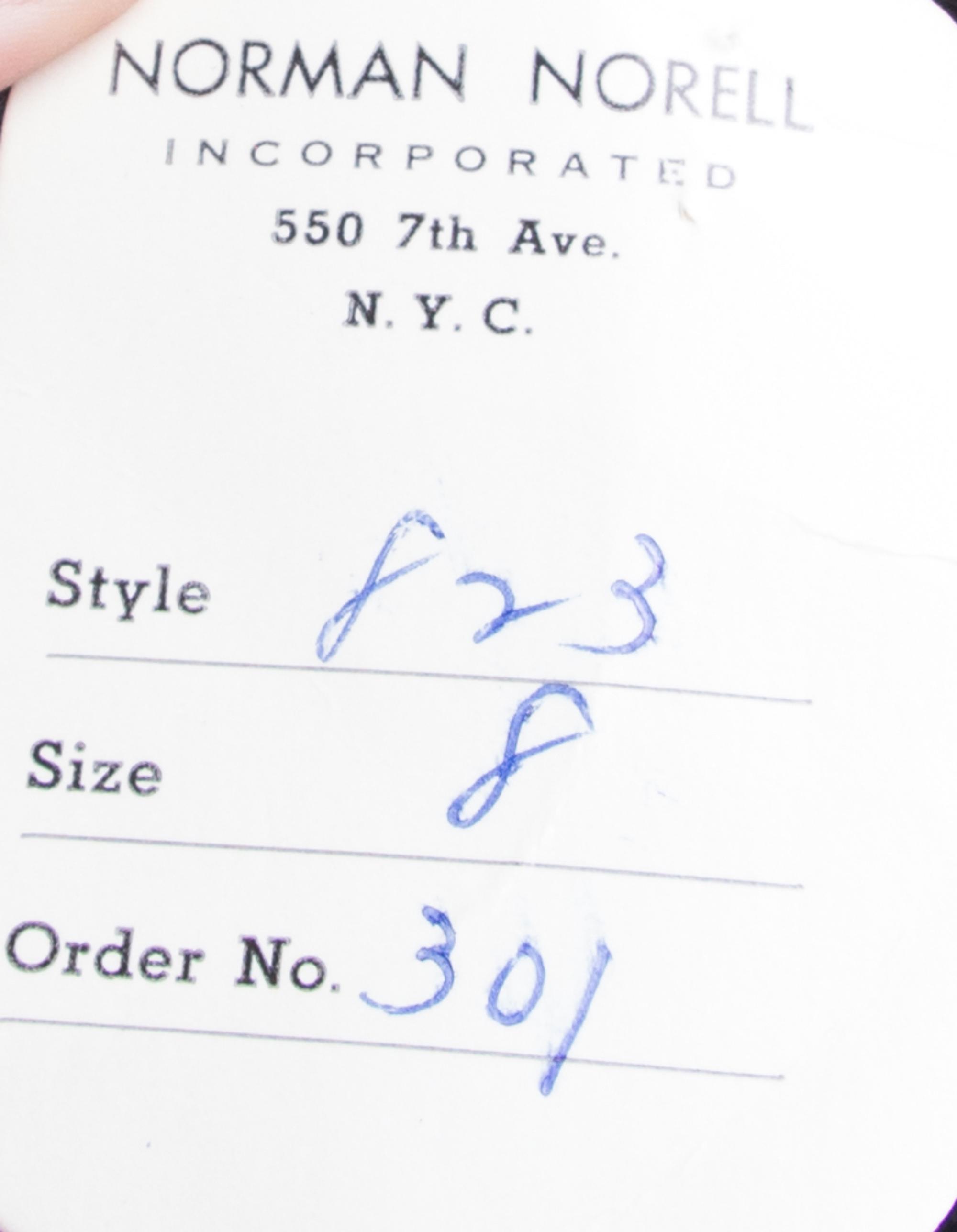 A Norell Black Wool Strapless Dress,