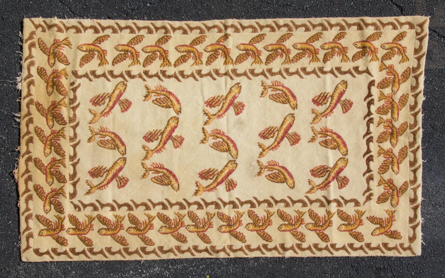 A Needlepoint Rug 53 x 33 inches. — 20TH CENTURY
