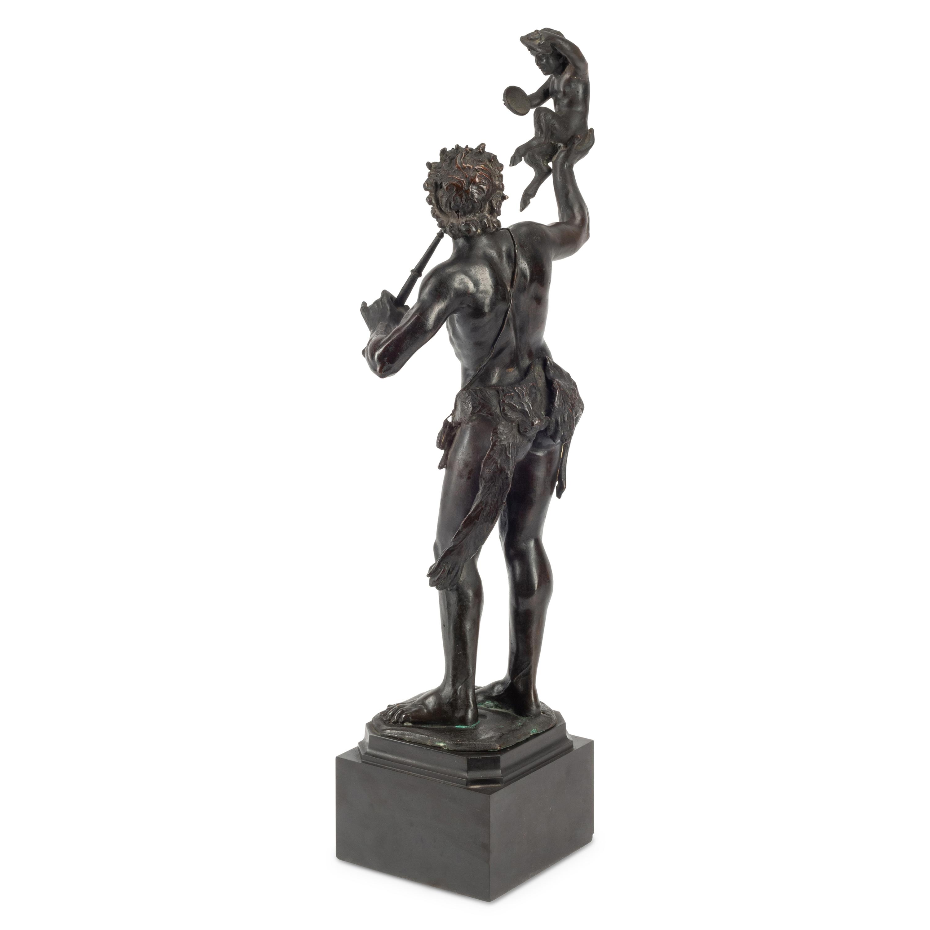 A Patinated Bronze Figure of Pan with a Faun