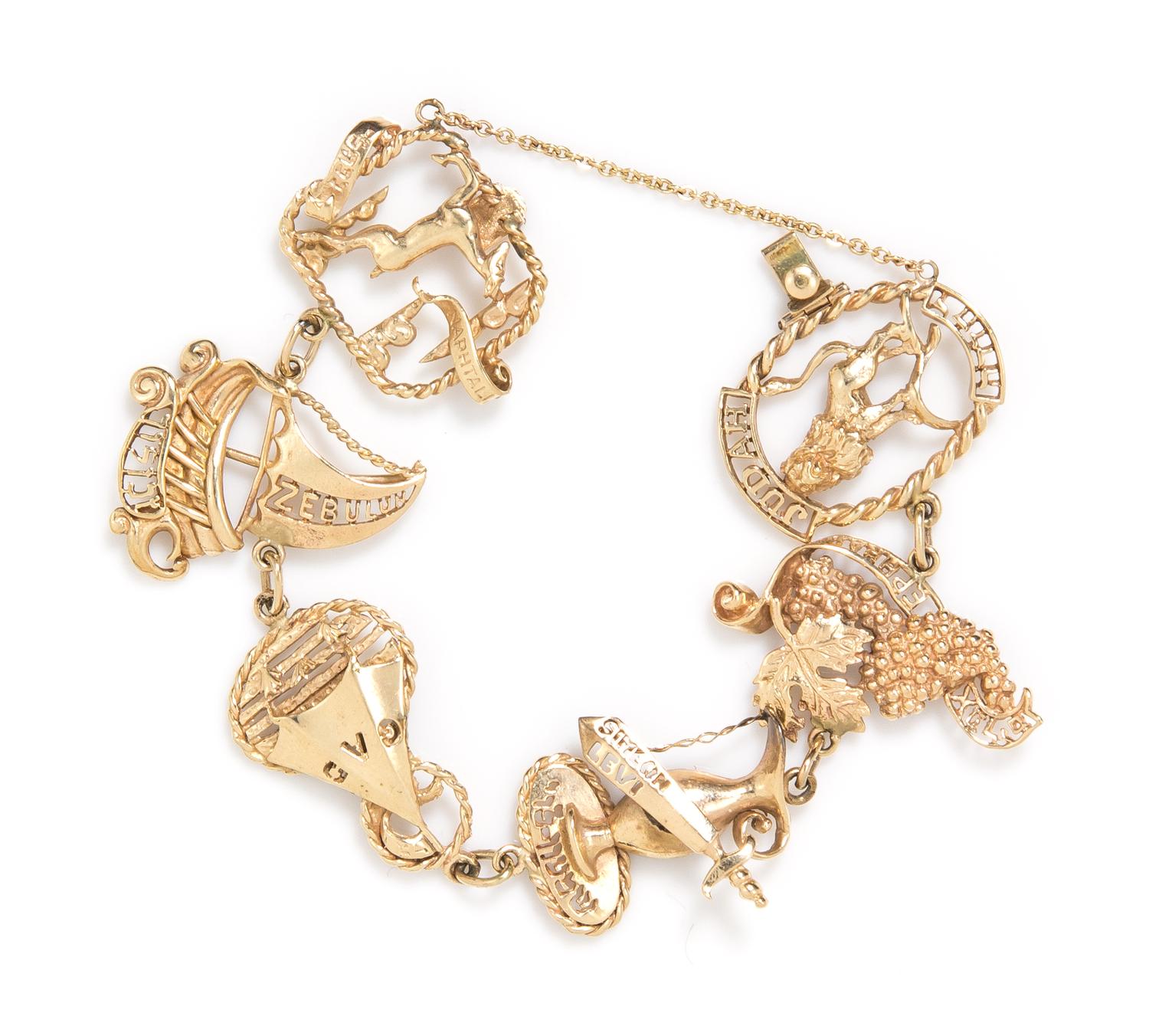 A 10 Karat Yellow Gold Charm Bracelet, 20.56 dwts.