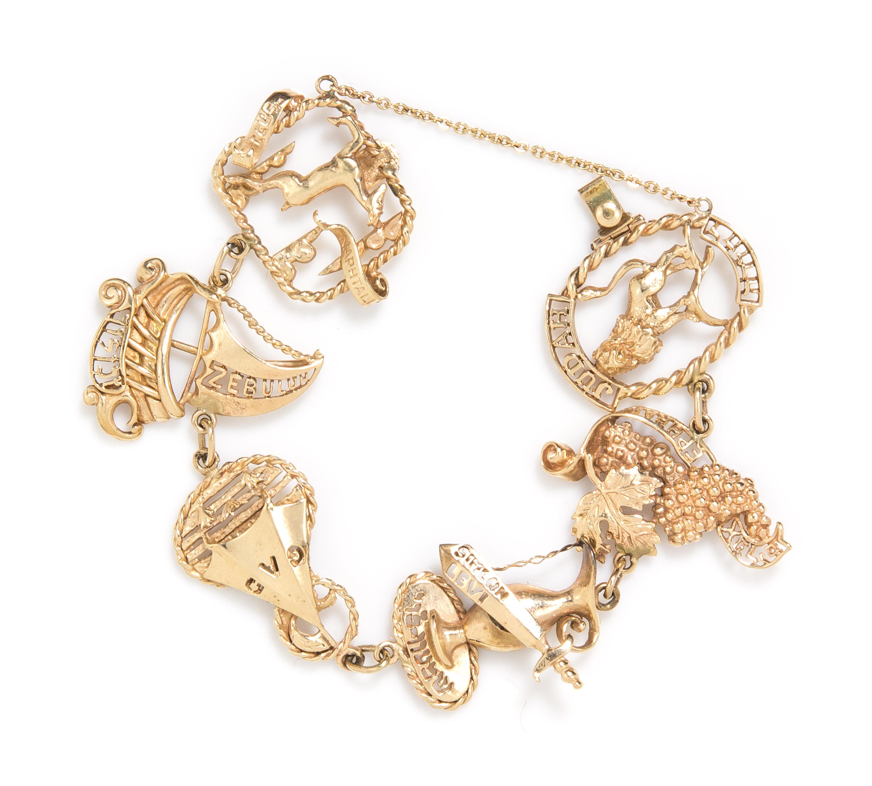 A 10 Karat Yellow Gold Charm Bracelet, 20.56 dwts.