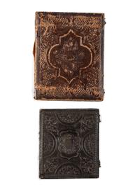 [EARLY PHOTOGRAPHY]. A group of 3 daguerreotypes featuring family groups, highlighted by a portrait of 11 family members, comprising: