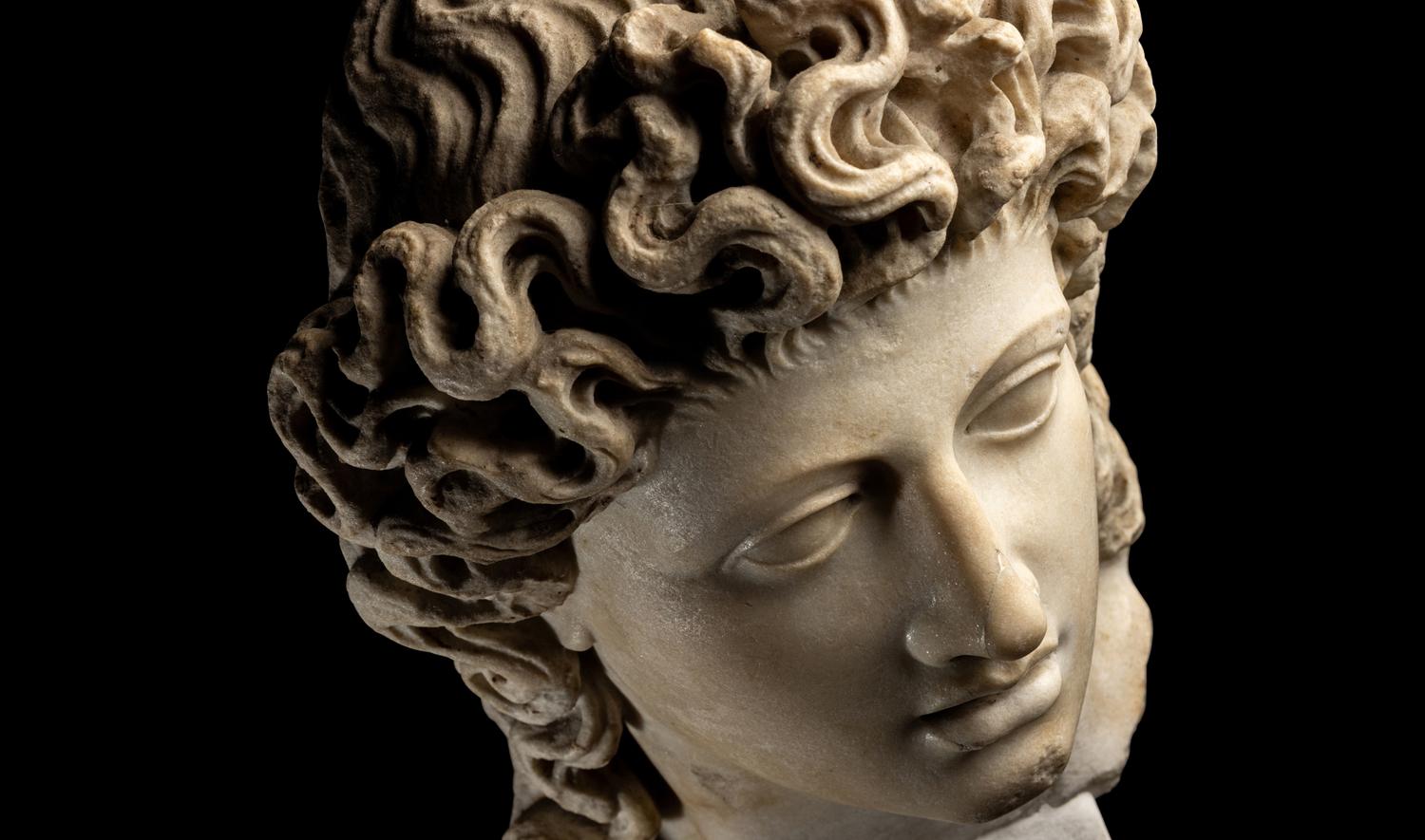 A Roman Marble Head of a Triton