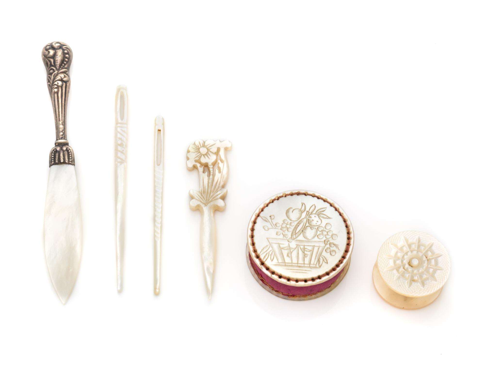 A Collection of Six Mother-of-Pearl Sewing Articles, , comprising a stiletto, thread winder, two bodkins and a pin cushion.