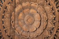 A Southeast Asian Carved Teakwood Mandala Panel