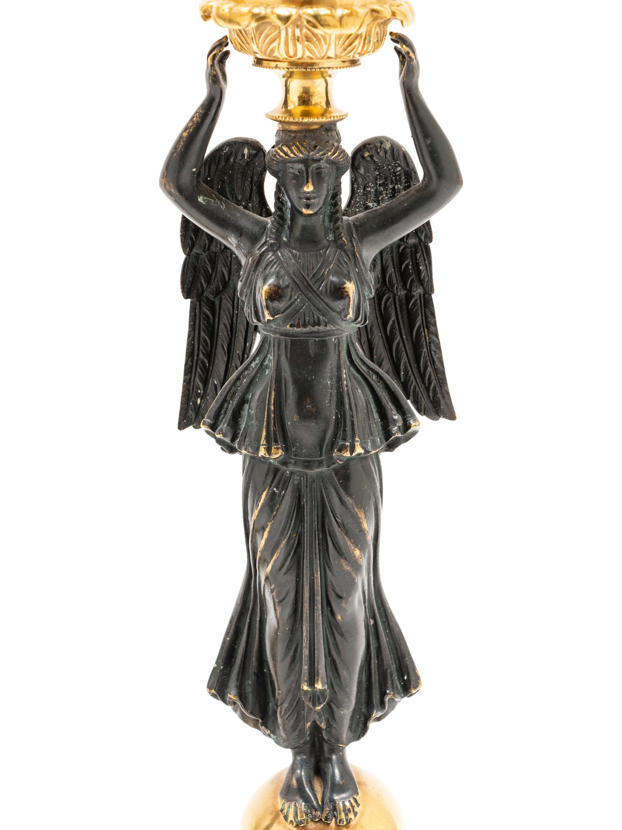 A Pair of Empire Style Gilt and Patinated Bronze Figural Candelabra