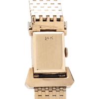 GENOVA, 14K YELLOW GOLD SURPRISE WATCH WITH RUBIES AND DIAMONDS