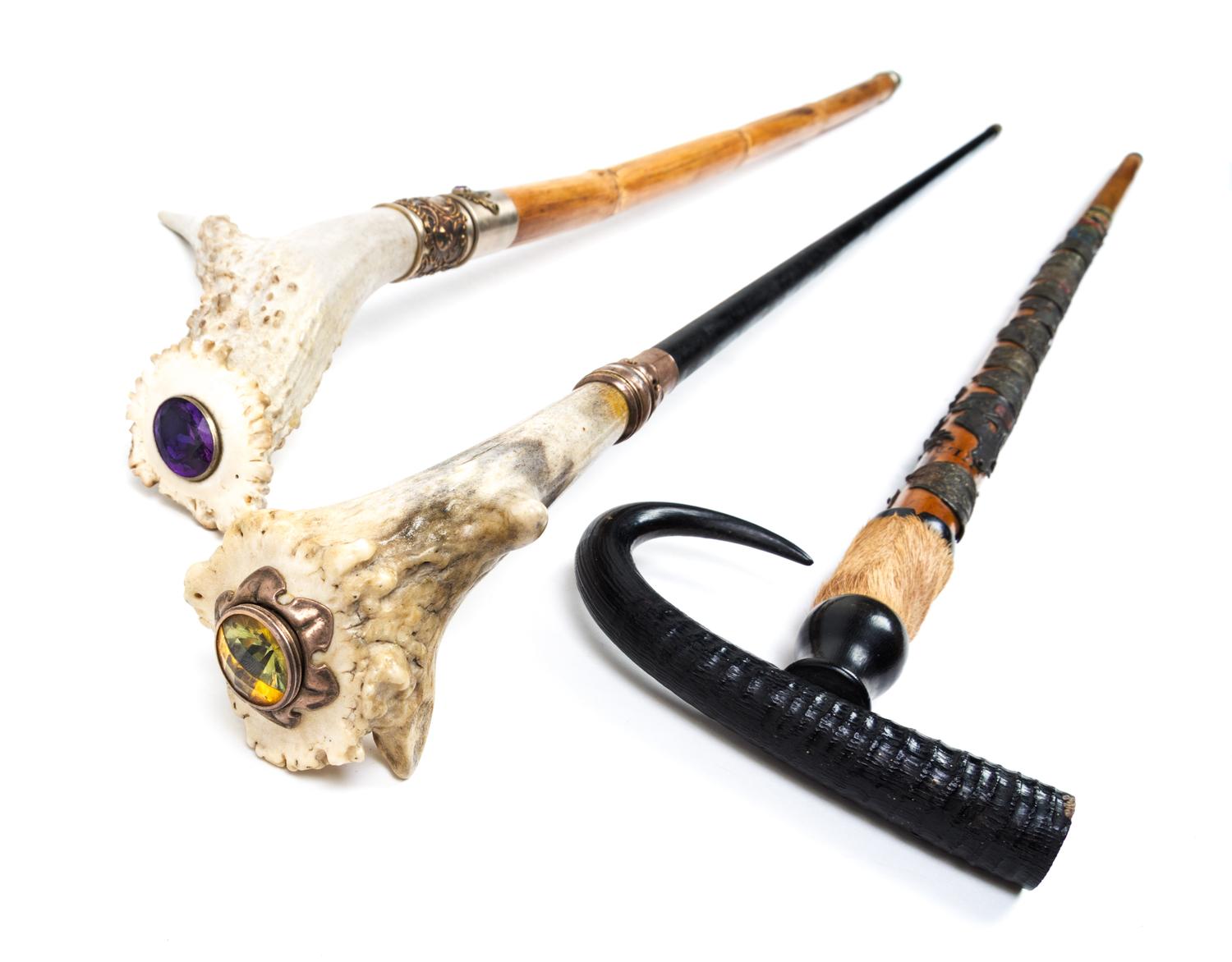 Three Sword Canes Length of longest 36 1/4 inches.