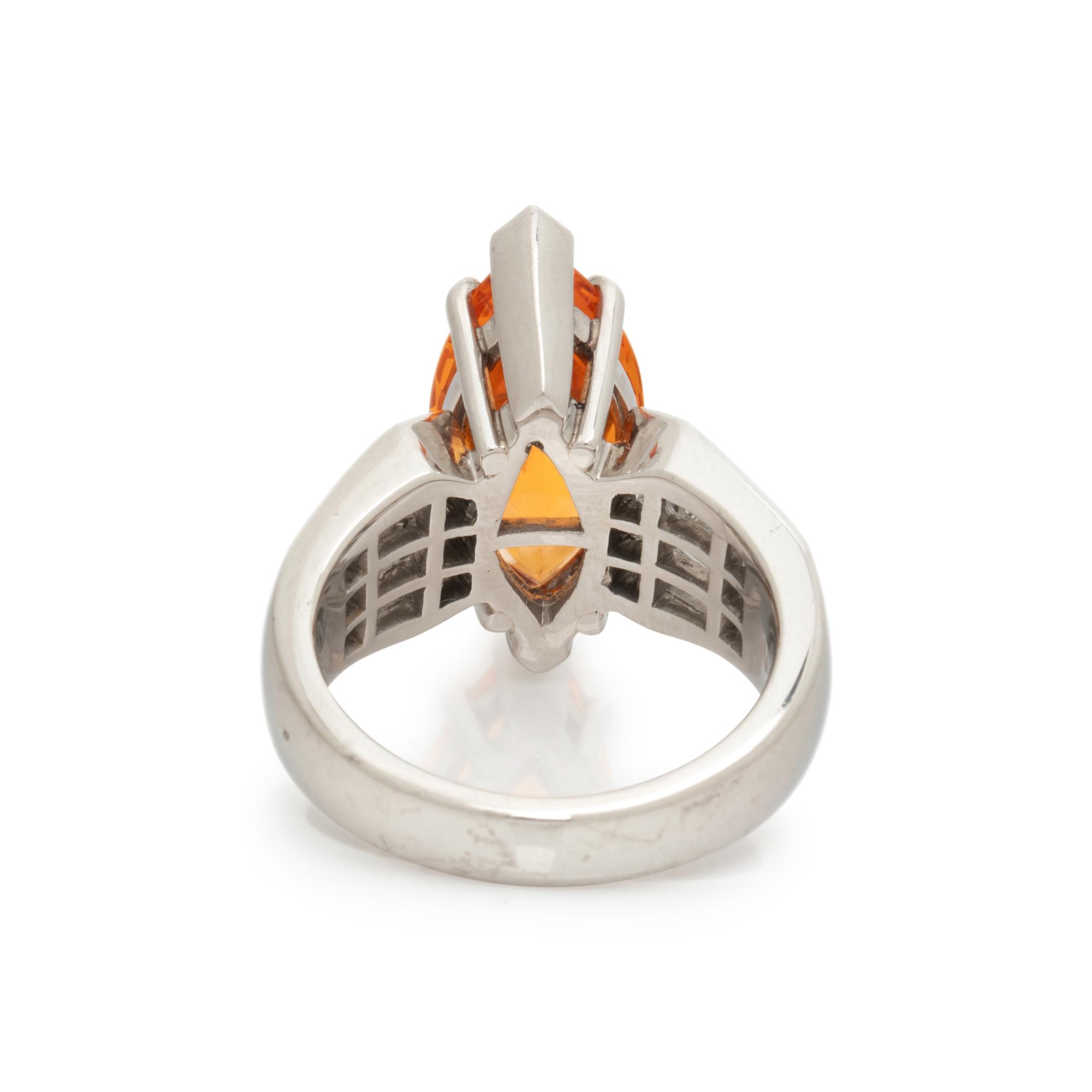 ORANGE GARNET AND DIAMOND RING