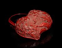A Chinese Cinnabar Lacquer Double-Peach Form Box and Cover