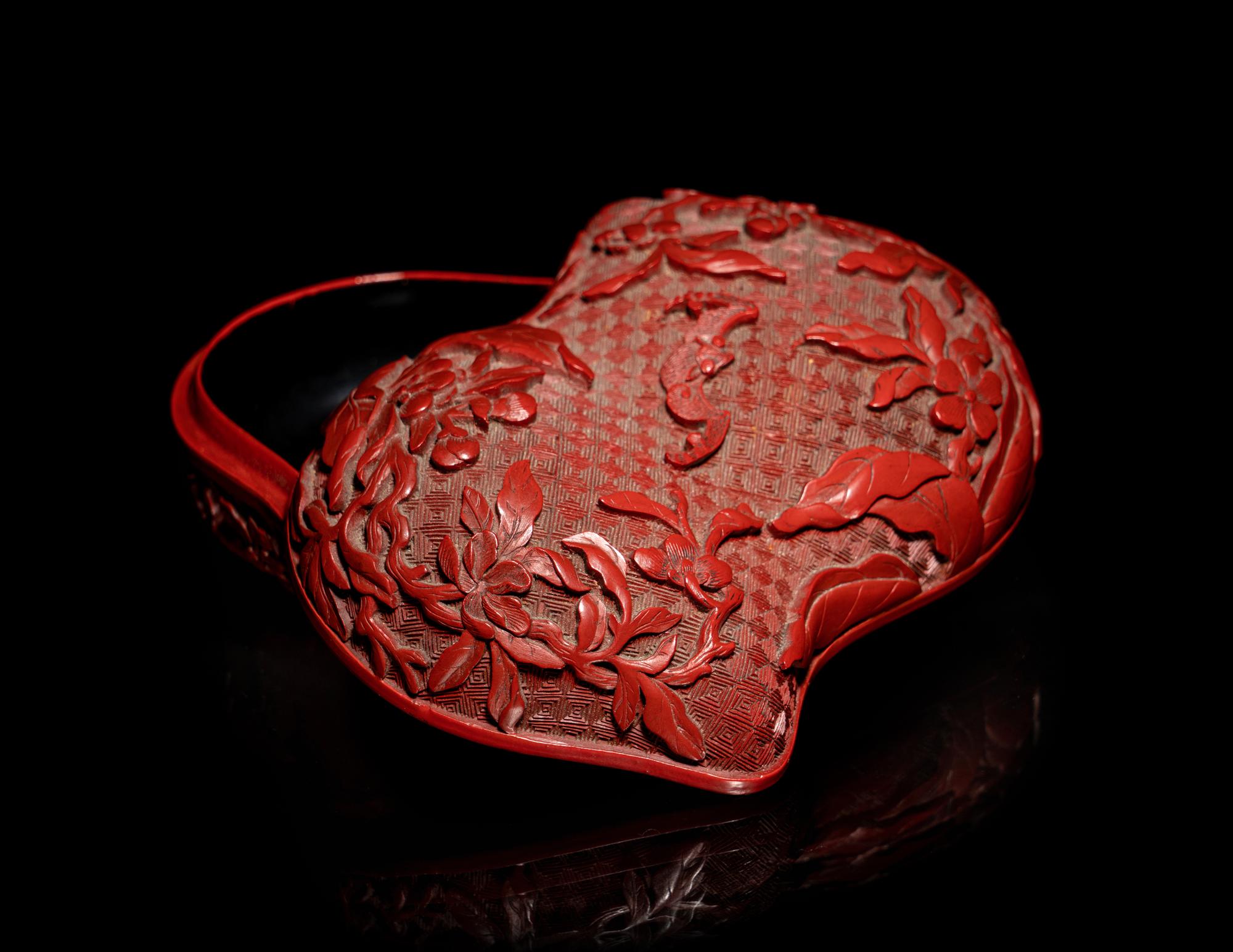 A Chinese Cinnabar Lacquer Double-Peach Form Box and Cover