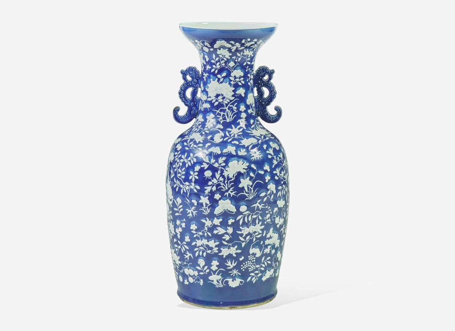 A very large Chinese blue ground white slip-decorated vase, mid 19th century 藍地白花貫耳瓶 十九世紀