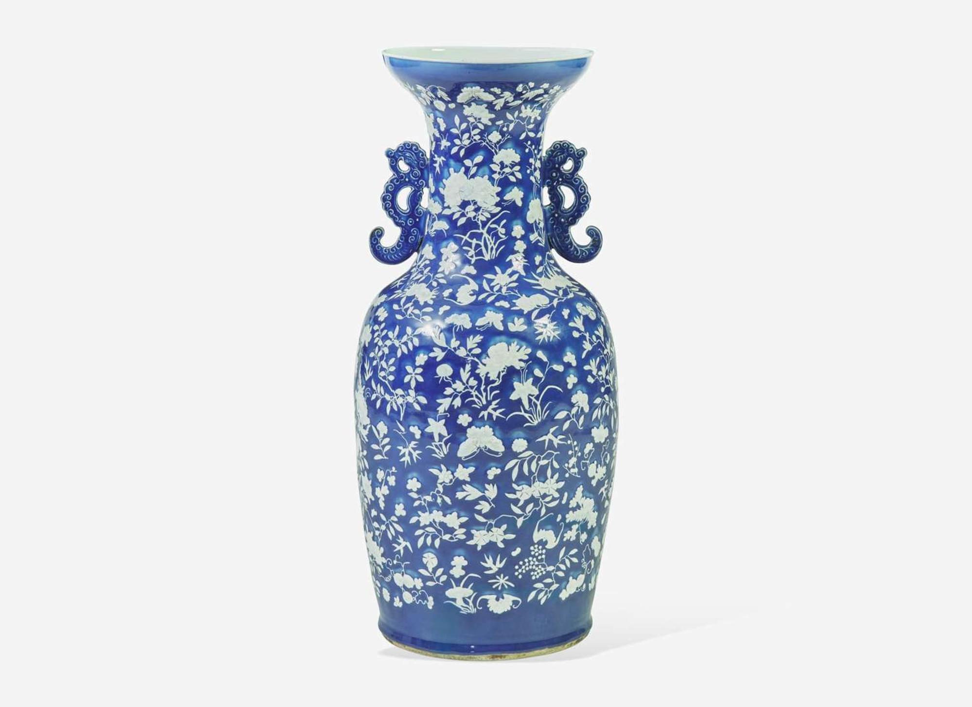 A very large Chinese blue ground white slip-decorated vase, mid 19th century 藍地白花貫耳瓶 十九世紀