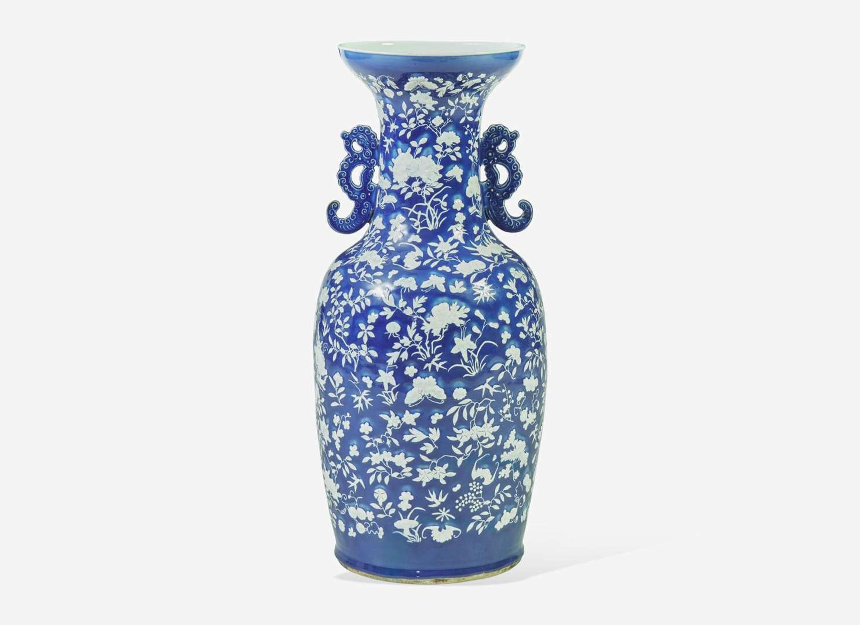 A very large Chinese blue ground white slip-decorated vase, mid 19th century 藍地白花貫耳瓶 十九世紀