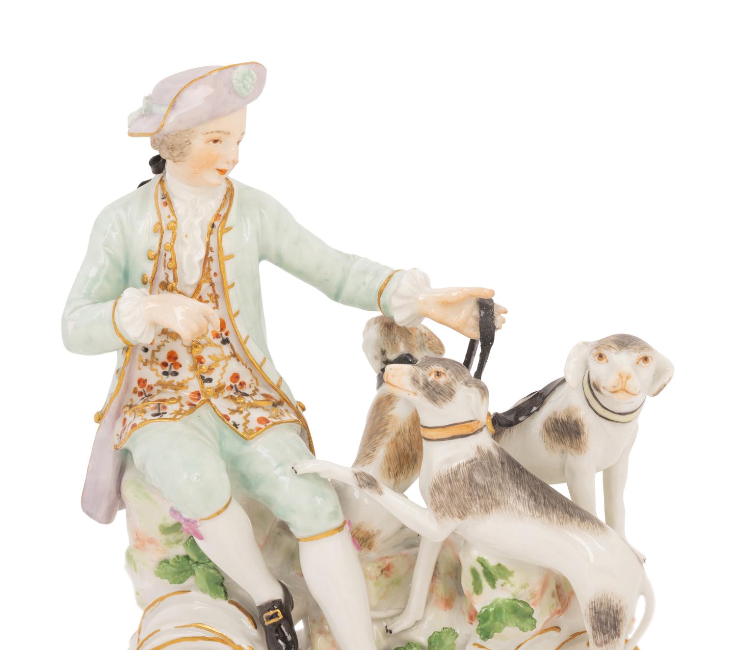 A Meissen Porcelain Figural Group of a Man with Hounds