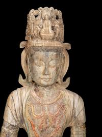 A Chinese Carved Stone Seated Guanyin Figure