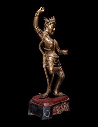 A Tibetan Gilt Lacquered Wood Figure of a Dancing Deity