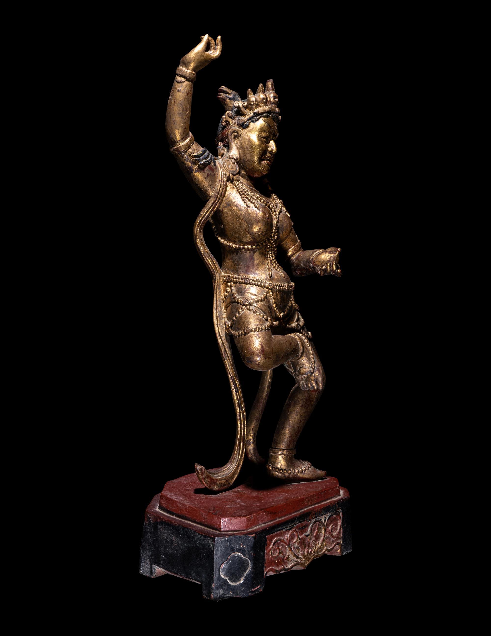 A Tibetan Gilt Lacquered Wood Figure of a Dancing Deity