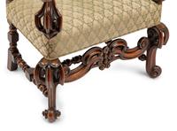 A Continental Baroque Style Carved Walnut Armchair