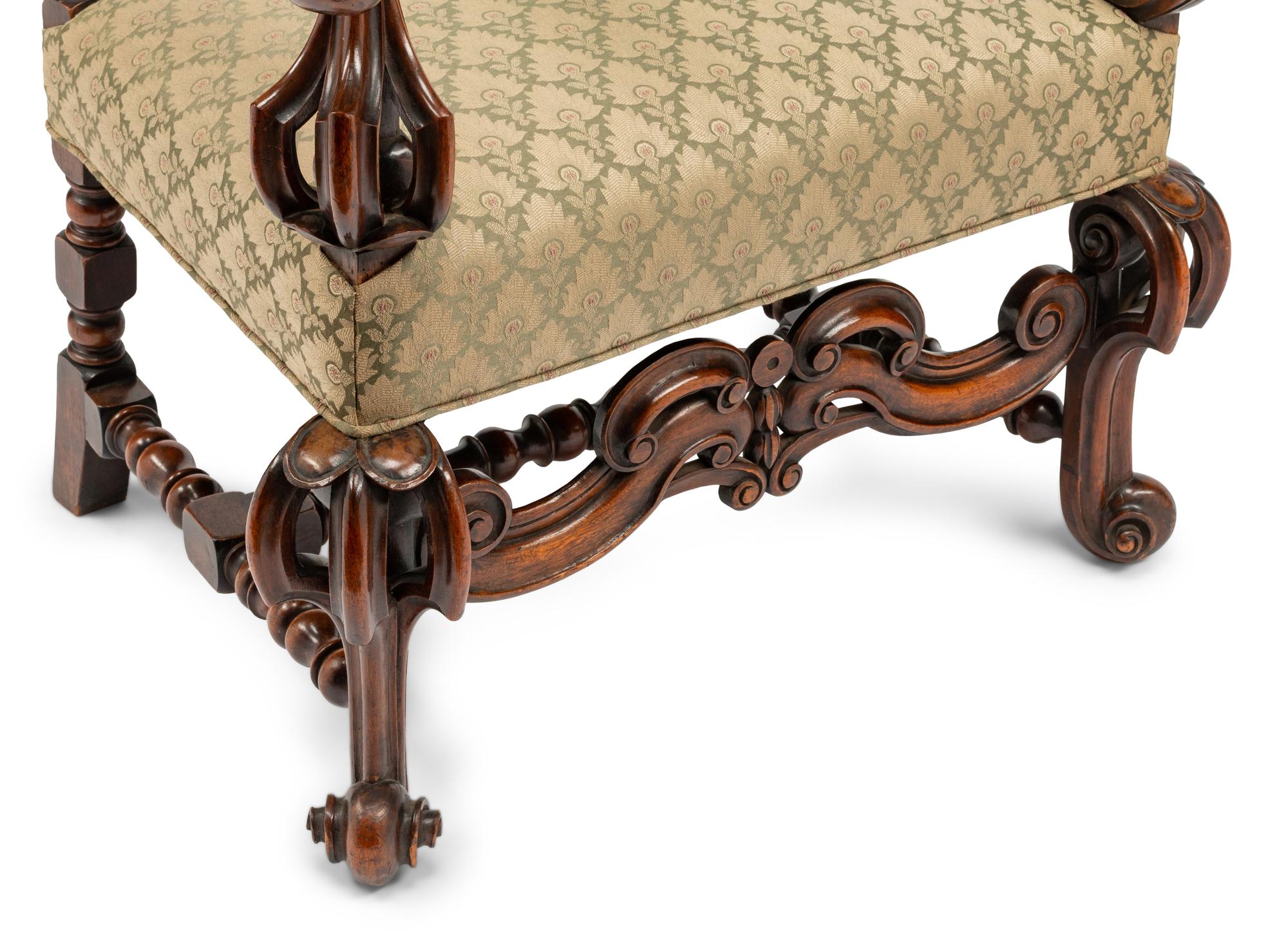 A Continental Baroque Style Carved Walnut Armchair
