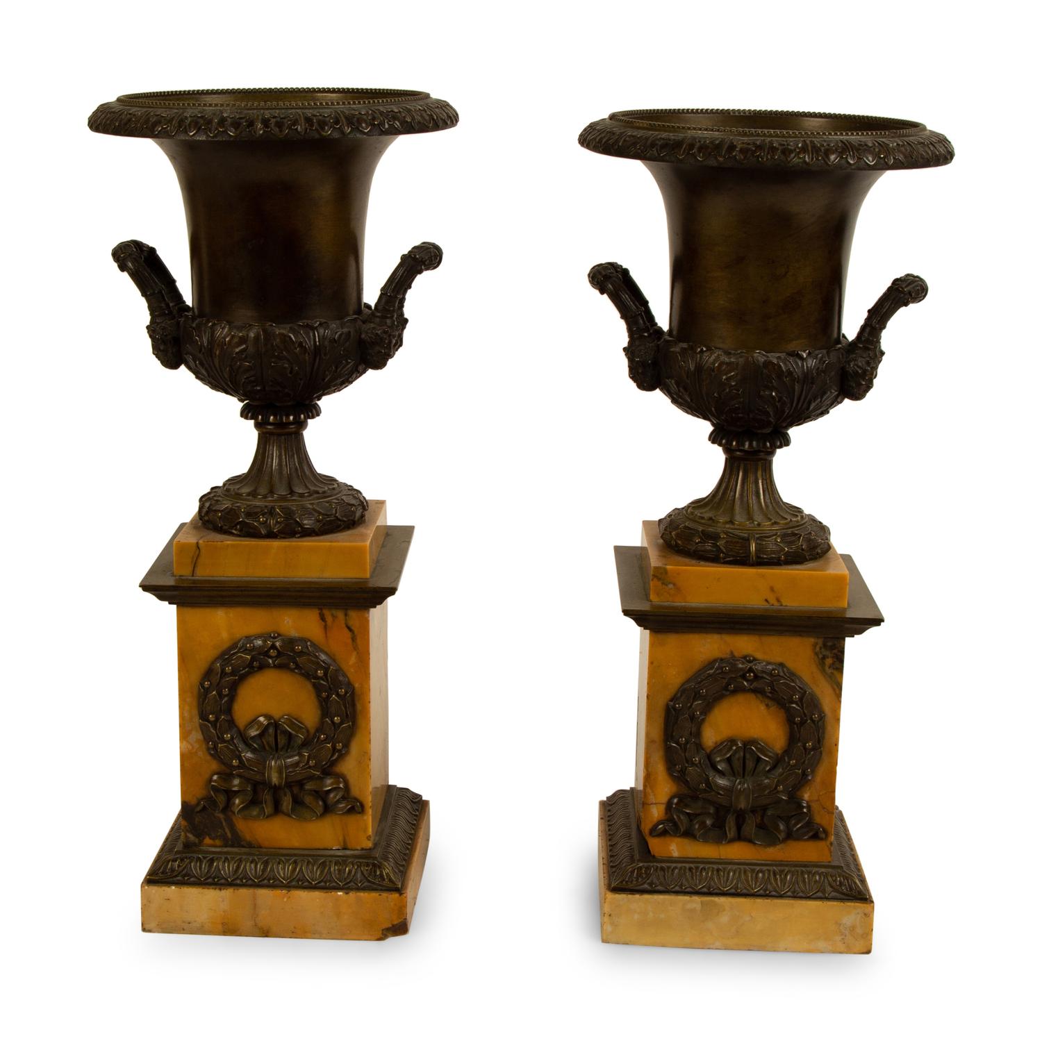 A Pair of French Bronze Urns on Marble Bases — 19TH/20TH CENTURY
