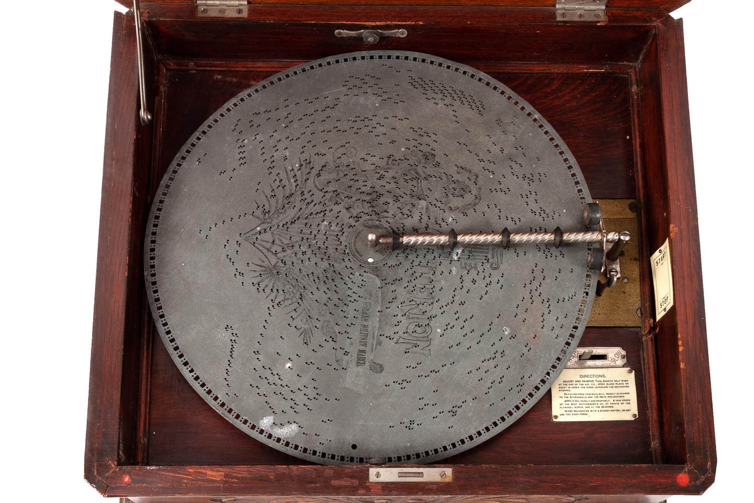 A Criterion 15 3/4 Inch Disc Music Box with 12 Discs